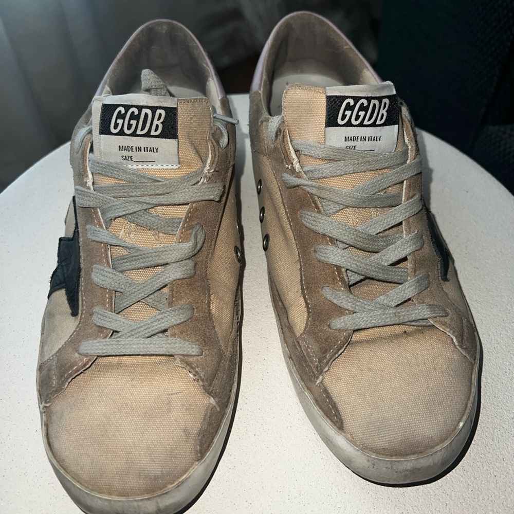 Golden Goose snickers. A bit worn on the back heel. Needs repair. Size 9 to 9’5